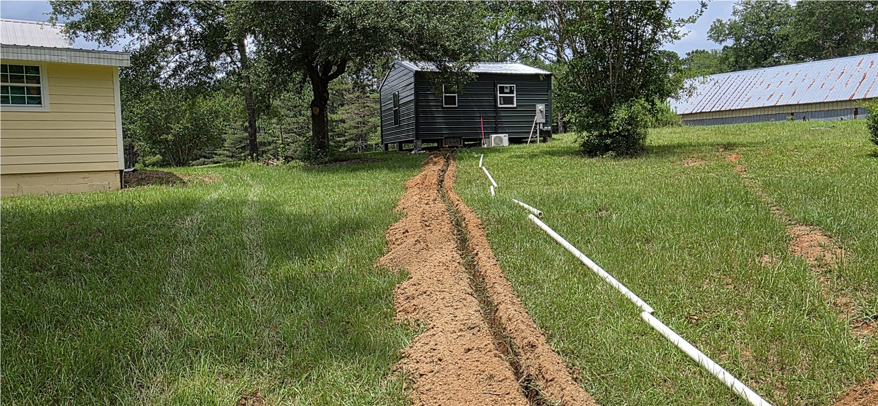 New water-line trench crossing the lawn