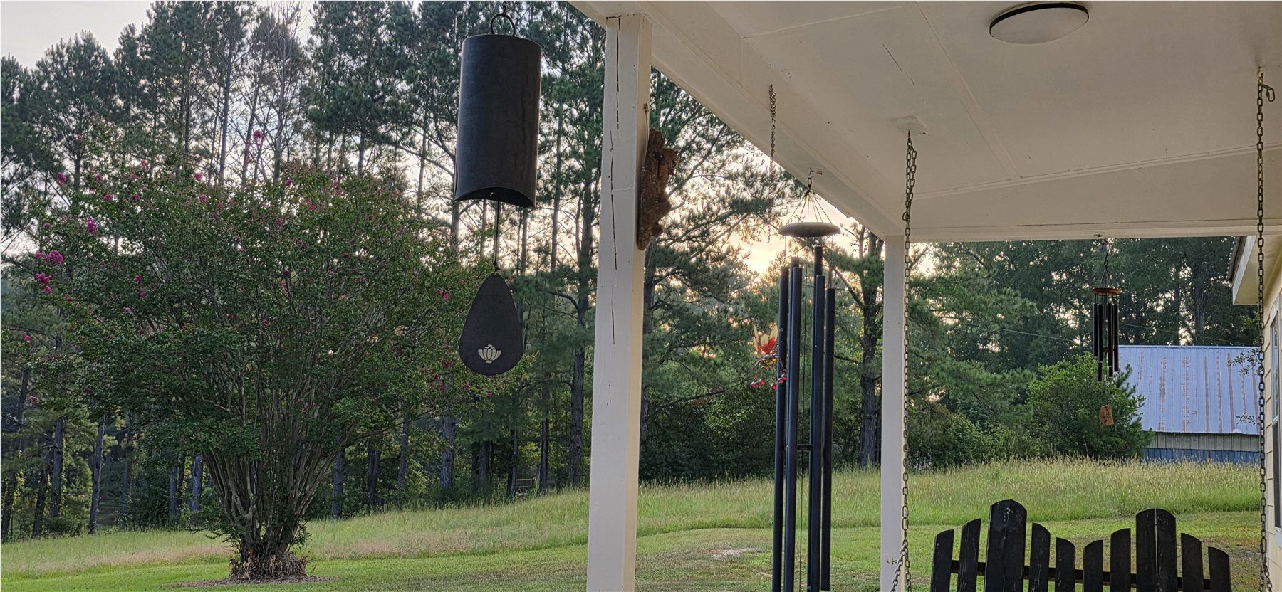 Porch wind chimes and open land