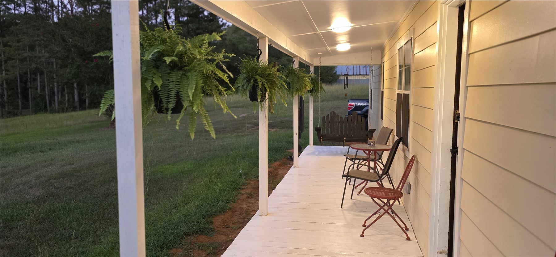 Porch illuminated at dusk