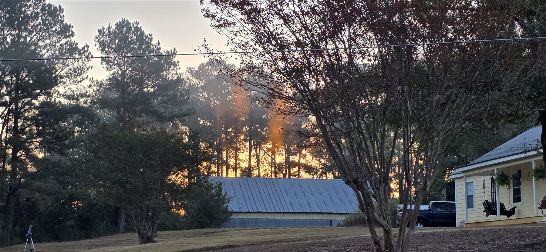 Barn roof beneath the sunrise