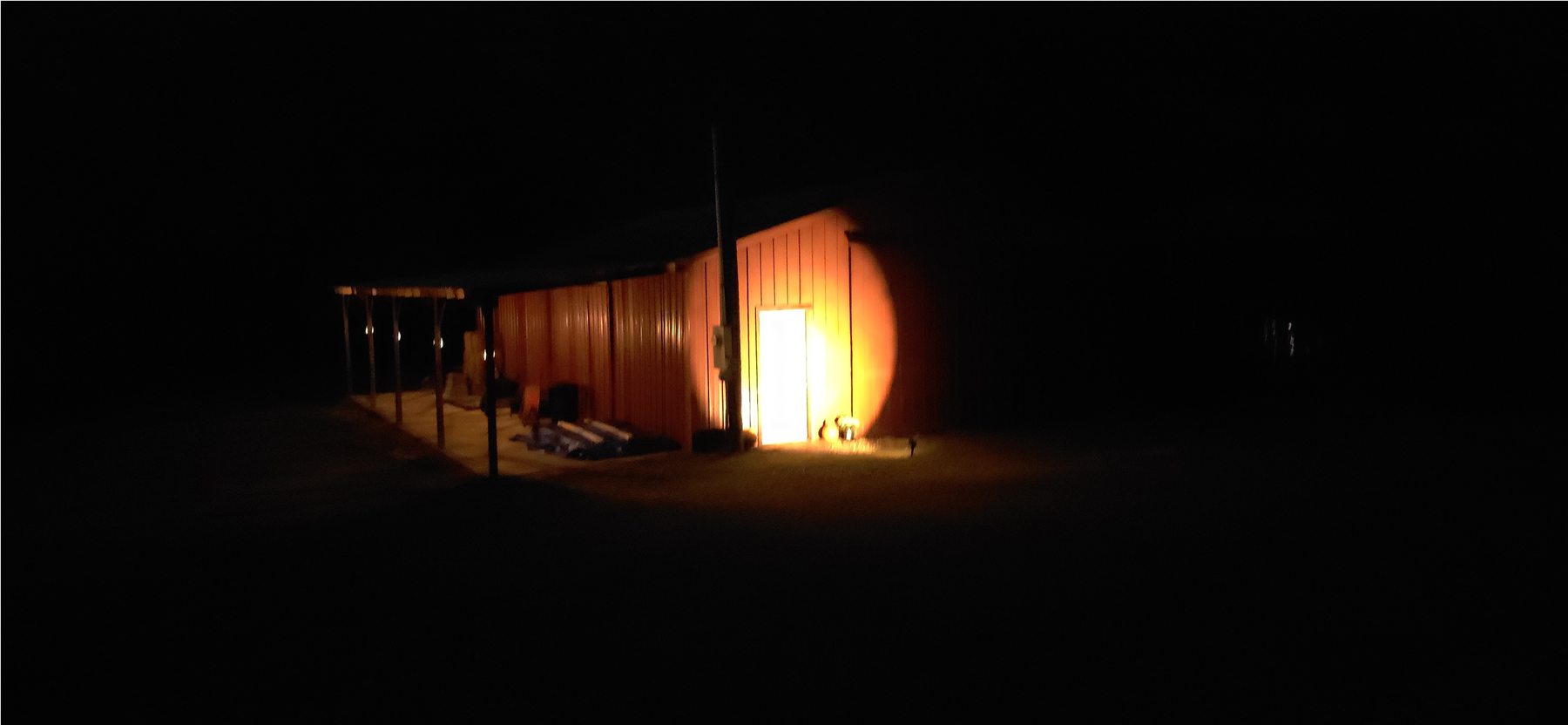 Barn exterior illuminated at night